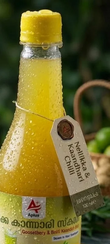 Close-up of a chilled bottle of Nellikka Kaandhari Squash with a kraft paper tag